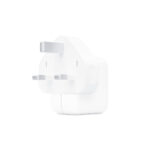 Apple 12W UK Adapter connected to a Lightning cable, charging an iPhone.