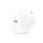 Close-up of the Apple 12W UK Adapter with its three-pin UK plug and sleek white design.